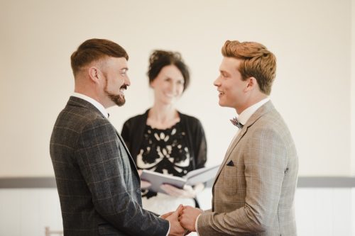 Grooms exchanging vows on their wedding day.