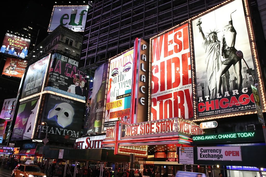 Billboards in NYC highlight various Broadway shows.