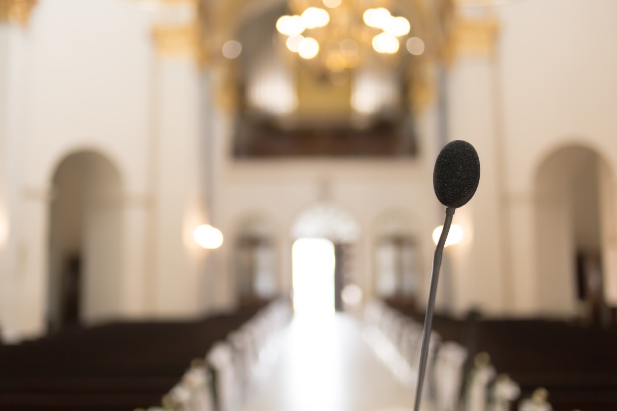 Close-up of microphone in blurry church