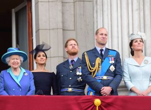 Queen Elizabeth II, Meghan Duchess of Sussex, Prince Harry Duke of Sussex, Prince William Duke of Cambridge and Katherine Duchess of Cambridge watch the RAF 100th anniversary flypast at Buckingham Palace in 2018