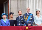 Queen Elizabeth II, Meghan Duchess of Sussex, Prince Harry Duke of Sussex, Prince William Duke of Cambridge and Katherine Duchess of Cambridge watch the RAF 100th anniversary flypast at Buckingham Palace in 2018