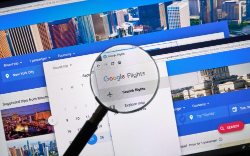 Magnifying glass using Google Travel search function for flights