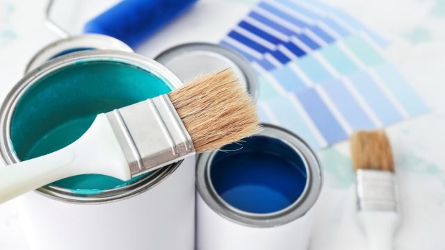 paint cans, swatches, and brushes