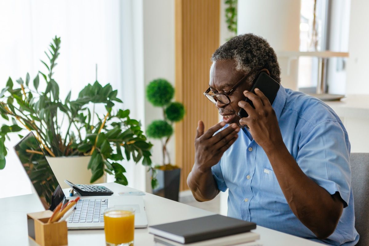 man on the phone with insurance company