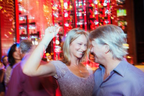 man and woman dancing together in a night club