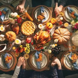 aerial view of a thanksgiving table full of traditional foods