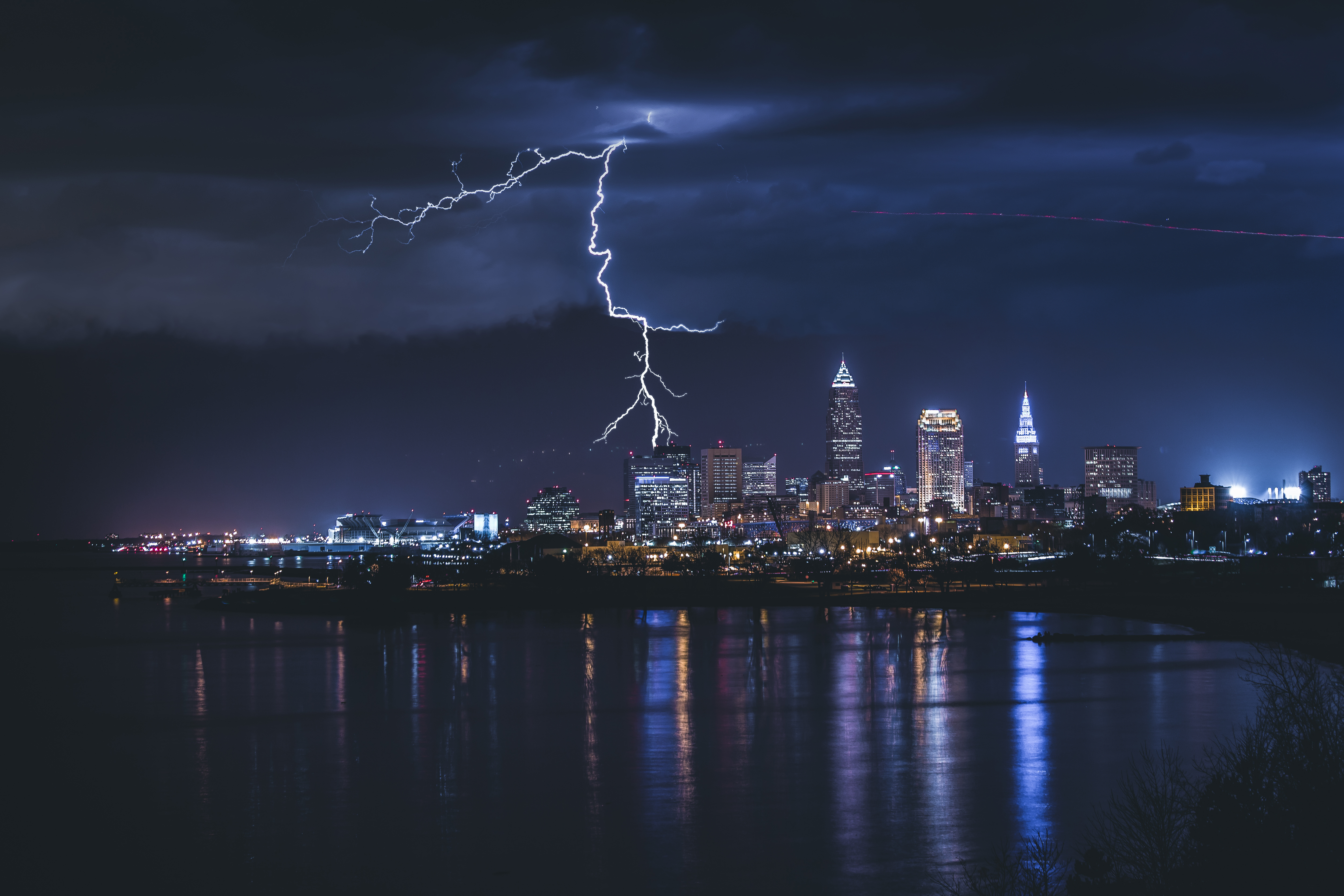 Thunder crackles in the night sky over Cleveland Ohio