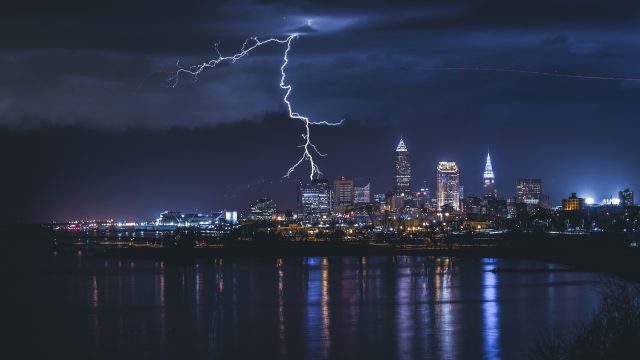 Thunder crackles in the night sky over Cleveland Ohio