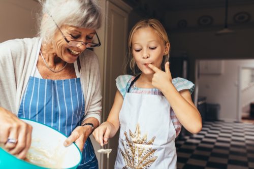 grandmother and granddaughter baking