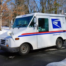 PRINCETON, NJ -10 FEB 2021- Winter view of a delivery truck from the United States Postal Service (USPS) on the street in New Jersey, United States after a snowfall.
