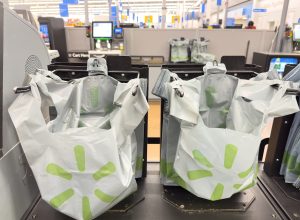 Close up of Walmart plastic bags at a Self Checkout register.