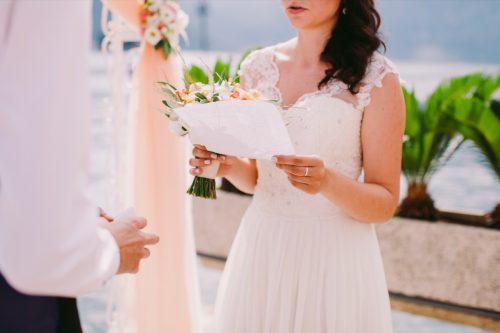 bride reading wedding vows to groom