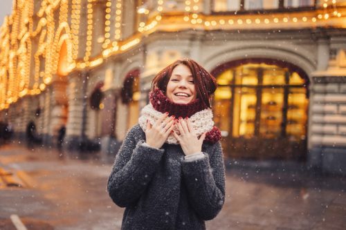 Woman wearing winter coat on the city street