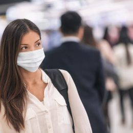 woman wearing a mask at the airport