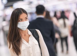 woman wearing a mask at the airport