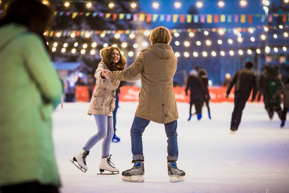 Couple Skating in Ice Rink