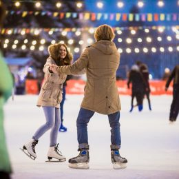 Couple Skating in Ice Rink