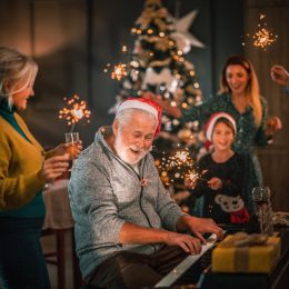 Family Singing Christmas Songs by Piano