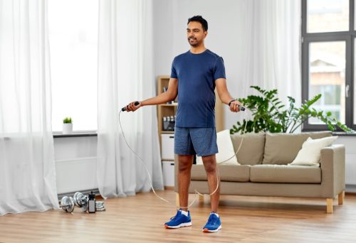 Guy jumping Rope in Living Room