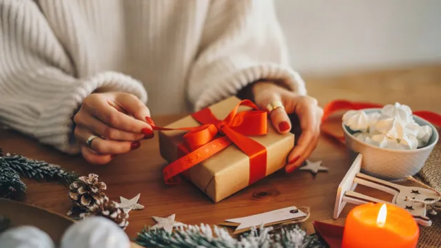 Woman Decorating and Wrapping Gifts