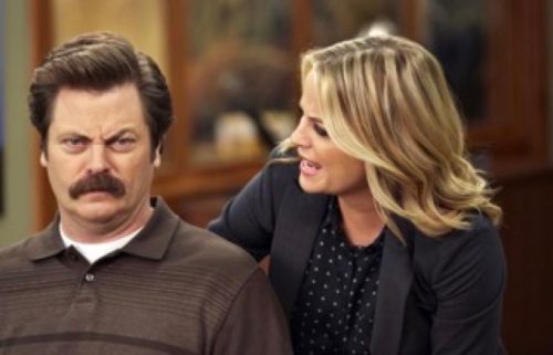 nick offerman as ron swanson and amy poehler as leslie knope in parks and rec