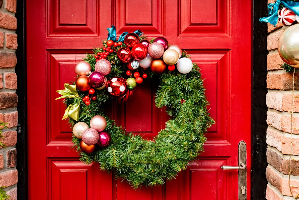 Red Wooden Front Door Decorated with Wreath,