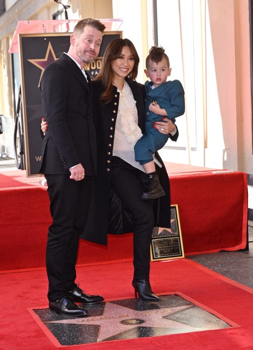 Macaulay Culkin, Brenda Song, and one of their children at Culkin's Hollywood Walk of Fame ceremony in December 2023
