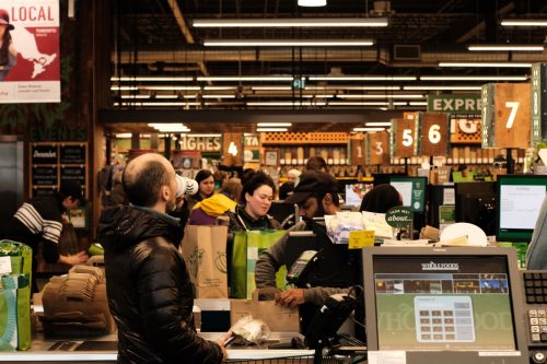 Ottawa, Ontario, Canada - December 31, 2019: Looking down the checkout line at the Whole Foods Market, Lansdowne.
