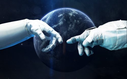 Astronaut hands with background of blue planet.