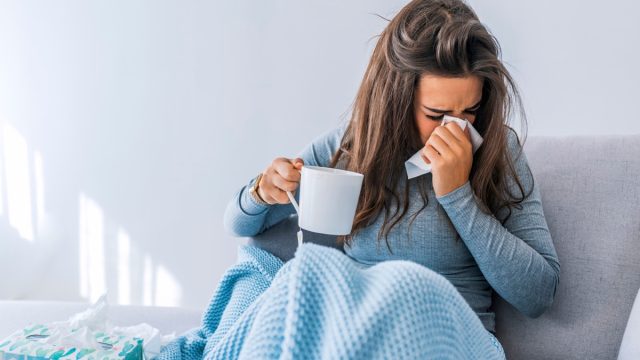 woman home sick with covid