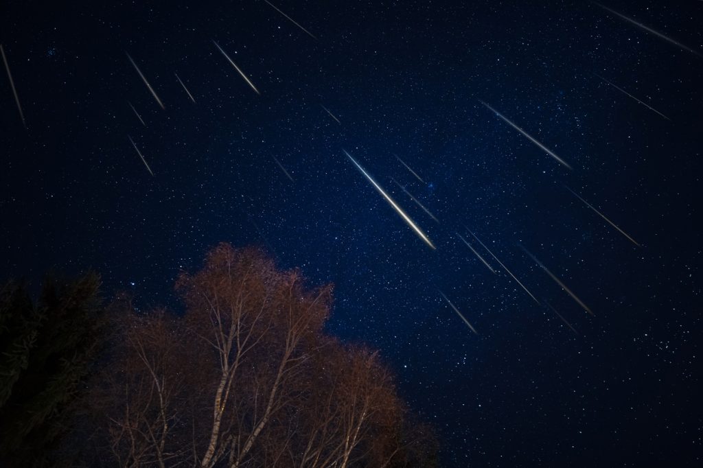 Meteors streaking through the sky during a meteor shower