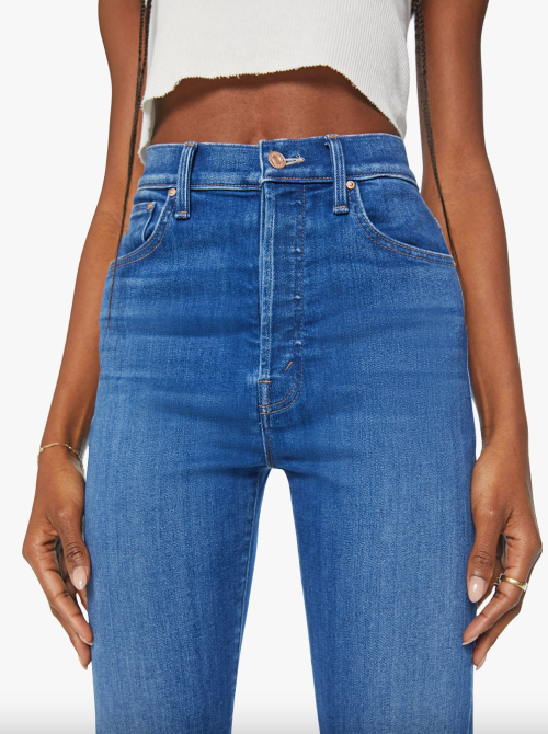 Close up of a woman wearing high-waisted jeans from Mother Denim