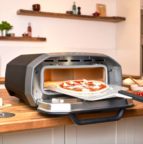 Product shot of Ooni Volt 12 Electric Pizza Oven on a kitchen counter