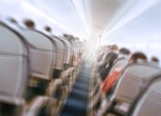 Blurry image of an airplane interior tilted, to show the concept of turbulence.