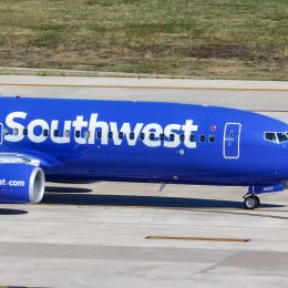 A Southwest plane taxiing on the runway