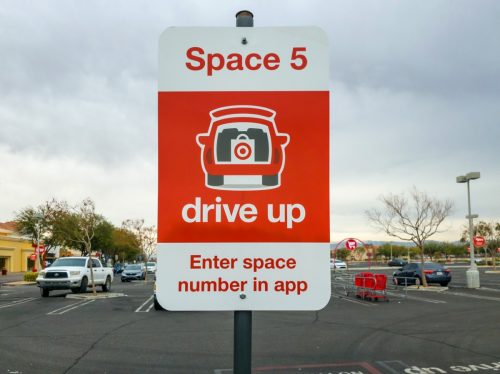 Apple Valley, CA, USA – December 21, 2021: Red drive up deliver sign for Target retail store in Apple Valley, California.