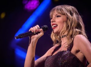 Taylor Swift performing at the 2019 Jingle Ball