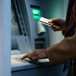 close up of woman using atm