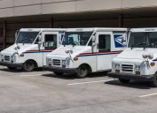 Indianapolis - Circa May 2017: USPS Post Office Mail Trucks. The USPS is Responsible for Providing Mail Delivery V