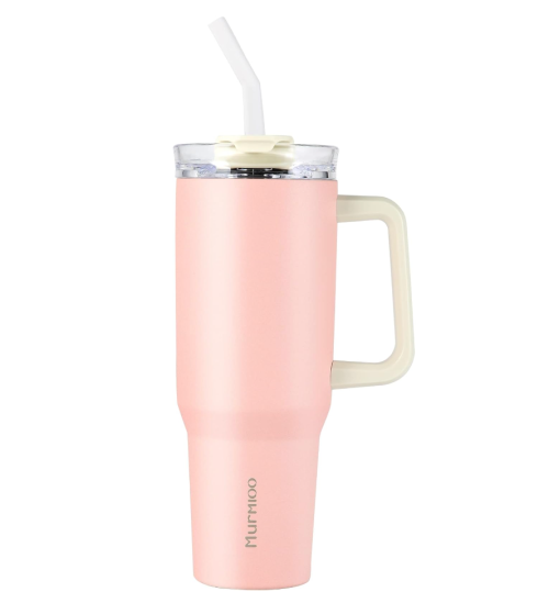 Pink tumbler against a white background