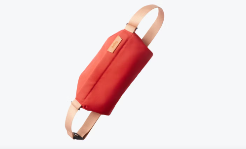Bellroy belt bag in red and pink against a white background