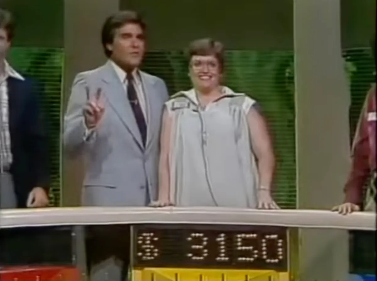 Chuck Woolery with contestant on Wheel of Fortune