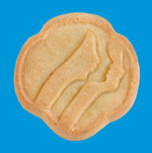 A Girl Scout Trefoil Cookie against a blue background