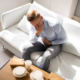 Unhealthy Fastfood Stomach Heartburn. Person After Eating Food