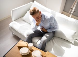 Unhealthy Fastfood Stomach Heartburn. Person After Eating Food