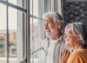 Retired Couple Looking Out Window