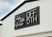Close up of a store sign for Saks OFF 5TH