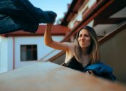 Woman Throwing Clothes Out the Window