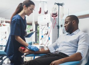 Businessman Donating Blood For People In Need In Bright Hospital