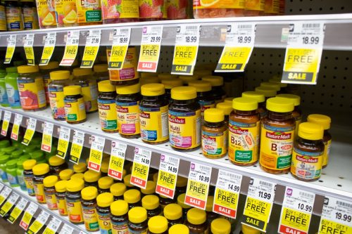 Los Angeles, California, United States - 08-10-2021: A view of several rows dedicated to Nature Made vitamin and supplement products, on display at a local grocery store.